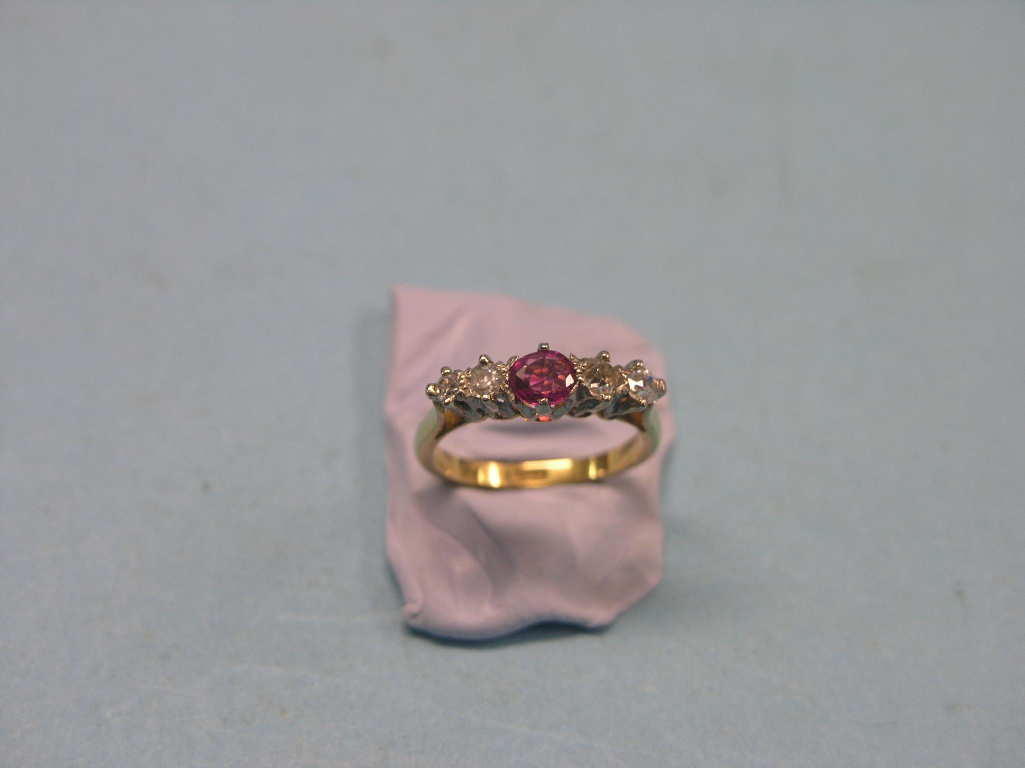 Appraisal: An ct gold half-hoop ring four diamonds single ruby claw