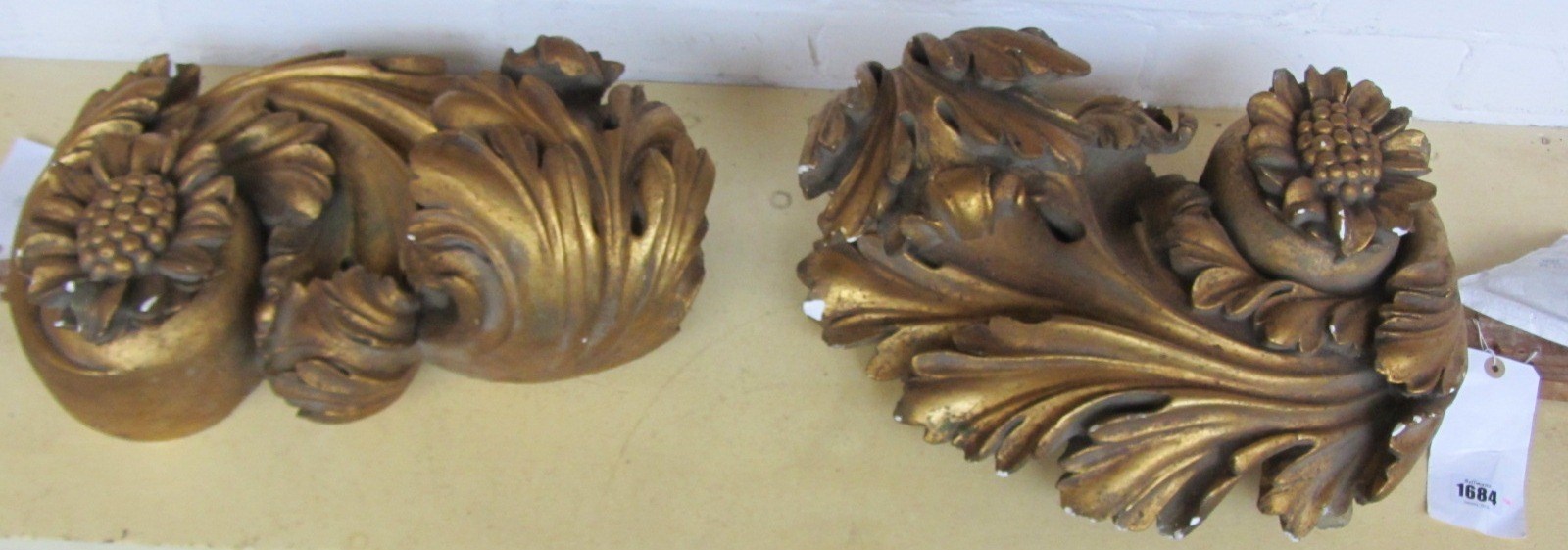 Appraisal: A pair of giltwood finials carved as acanthus leaves cm