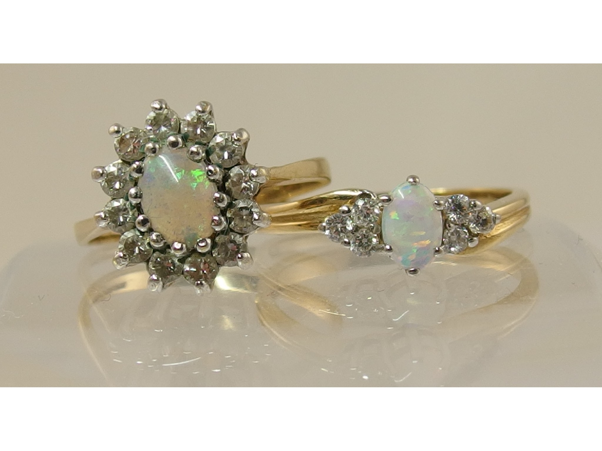 Appraisal: Two ct opalite and clear gem stone cluster rings