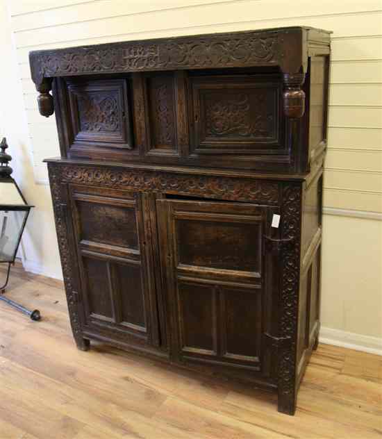 Appraisal: A late th century carved oak court cupboard dated with