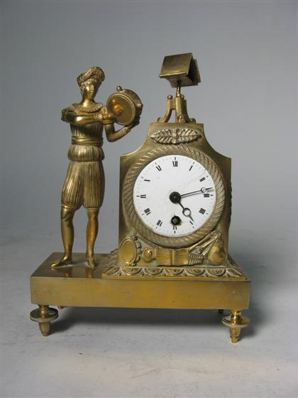 Appraisal: Small French brass figural table clock th century Cobalt enamel