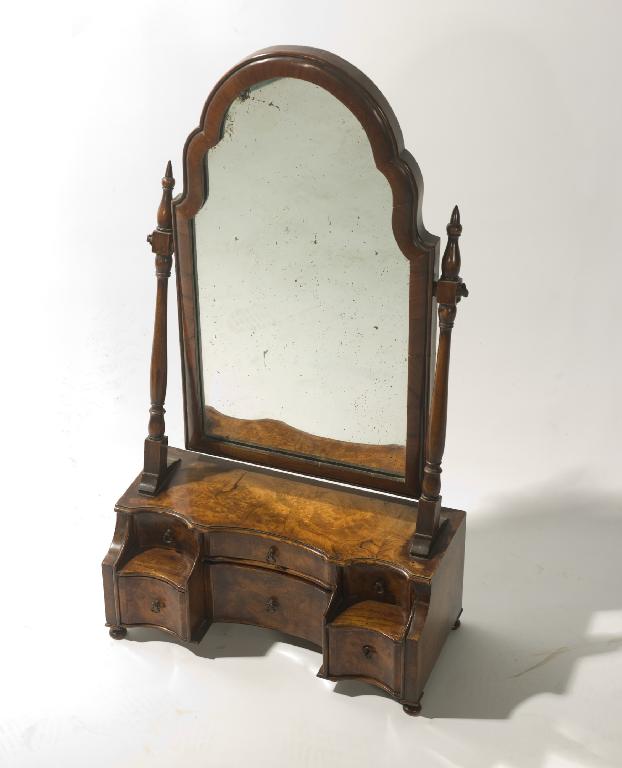 Appraisal: WALNUT TOILET MIRROR IN EARLY th CENTURY STYLE the arched