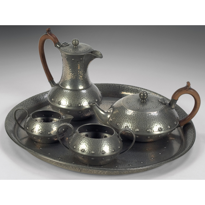 Appraisal: English Arts and Crafts tea set in hammered pewter made