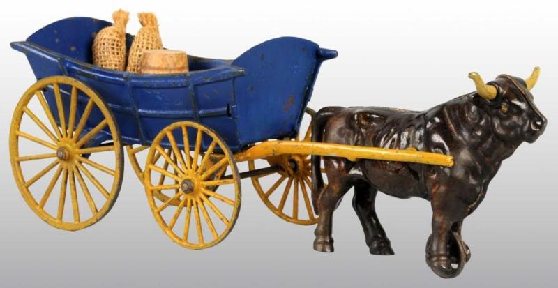 Appraisal: Cast Iron Tin Hubley Ox-Drawn Farm Wagon Toy Description Pulled