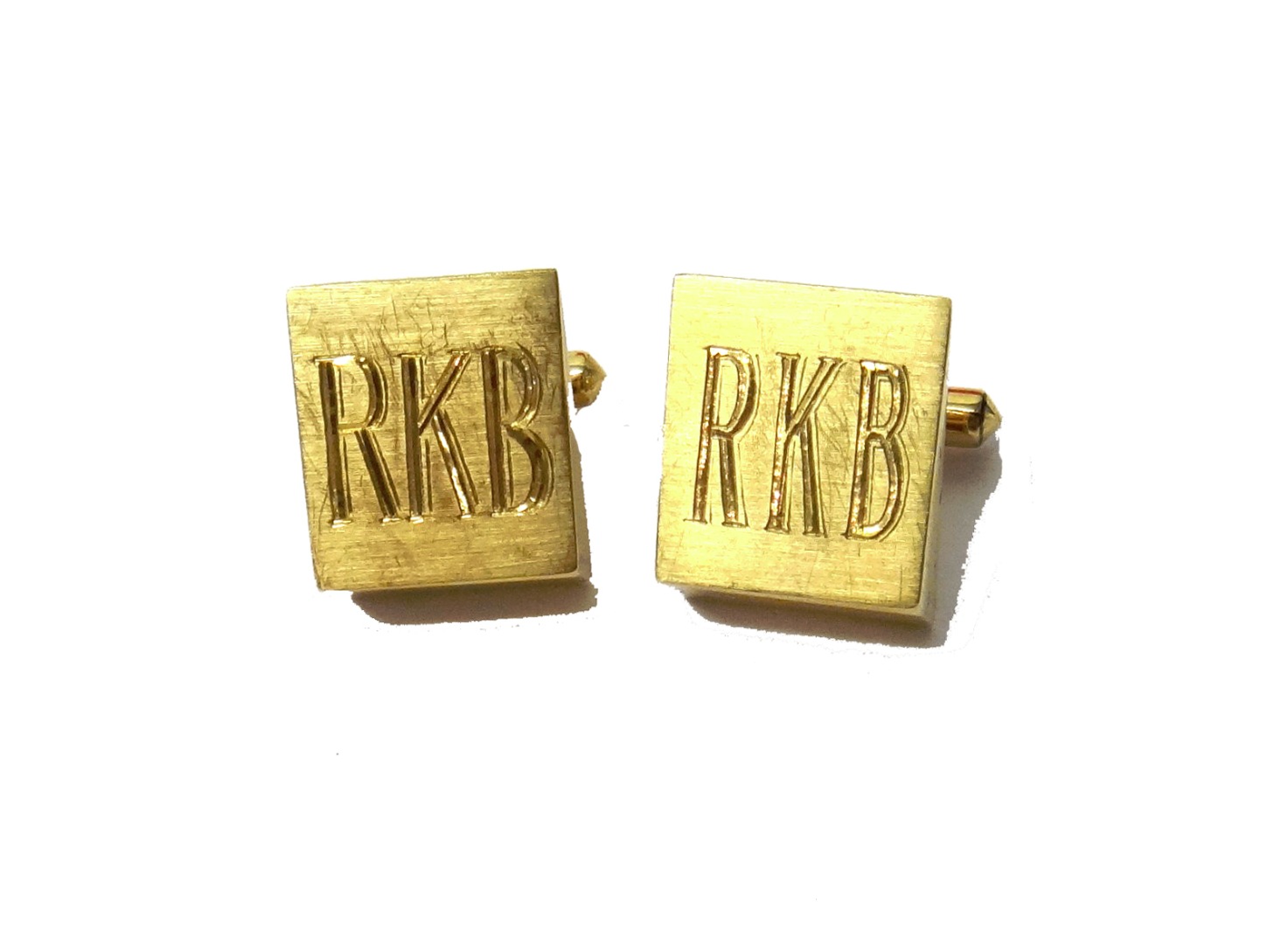 Appraisal: A pair of gold cufflinks the fronts of angular panel