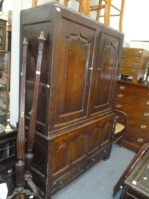 Appraisal: AN TH CENTURY AND LATER OAK LINEN CUPBOARD the upper