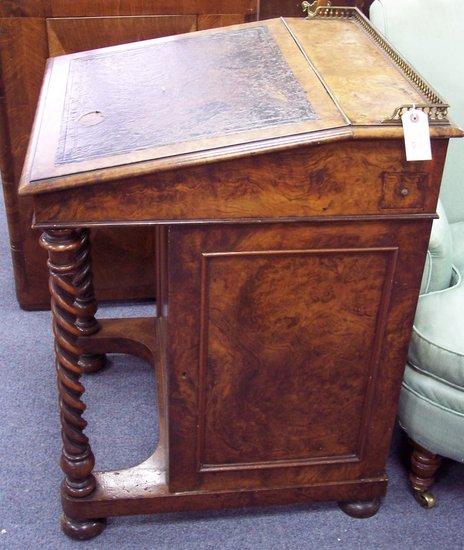 Appraisal: A th Century walnut Davenport the galleried top above a