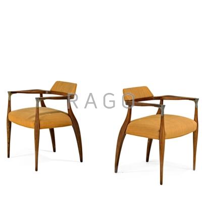 Appraisal: DANISH Pair of armchairs s Walnut upholstery and nickeled metal