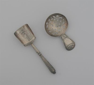 Appraisal: A George III caddy spoon with a bright-cut stem and