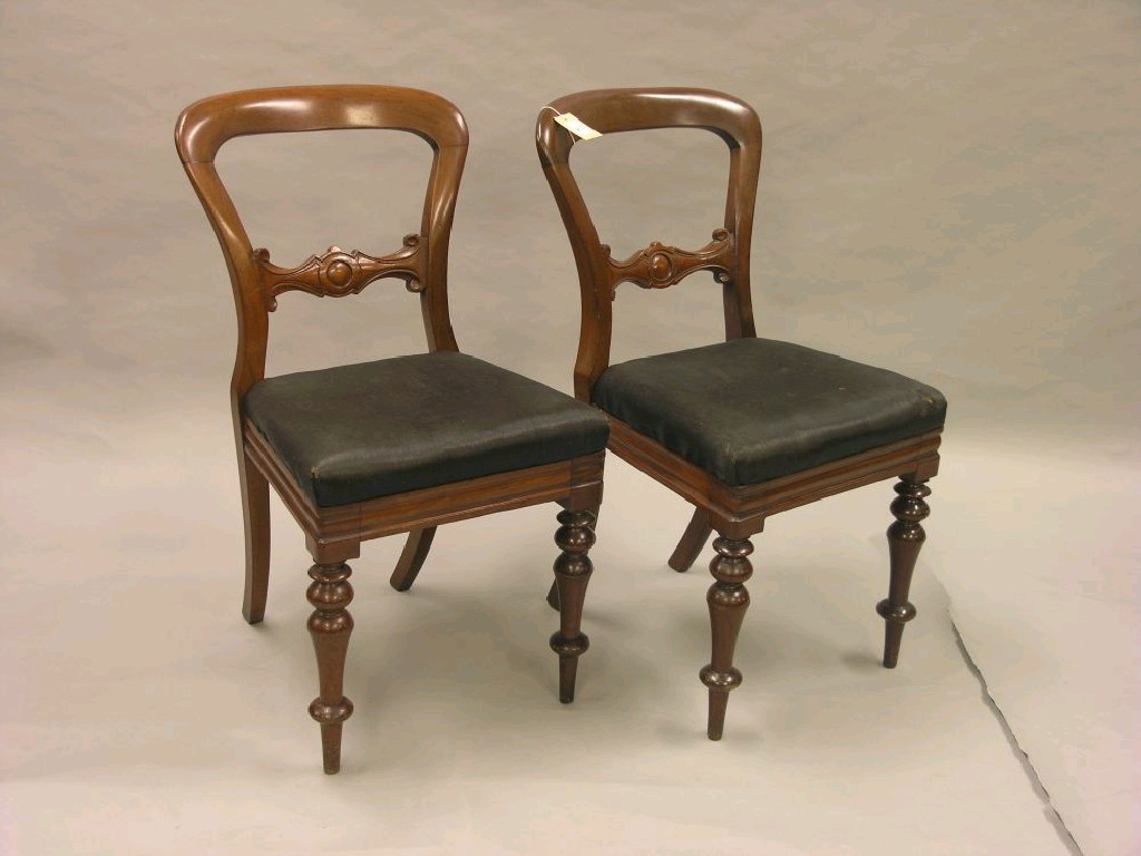 Appraisal: A set of four Victorian mahogany balloon-back dining chairs backs