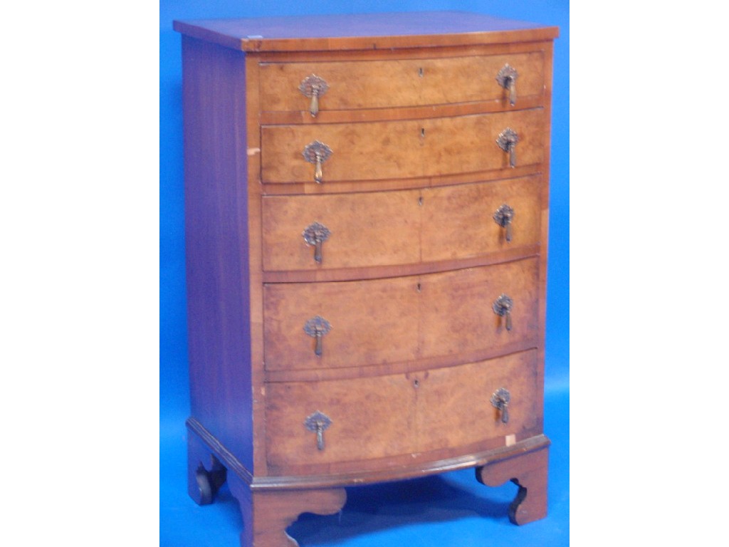 Appraisal: A burr walnut bow fronted chest of five graduated drawers