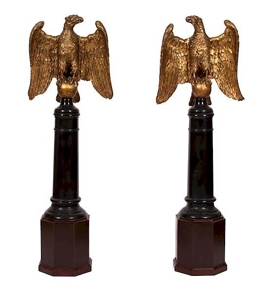 Appraisal: A Pair of Continental Giltwood Eagles on Later Stands Height