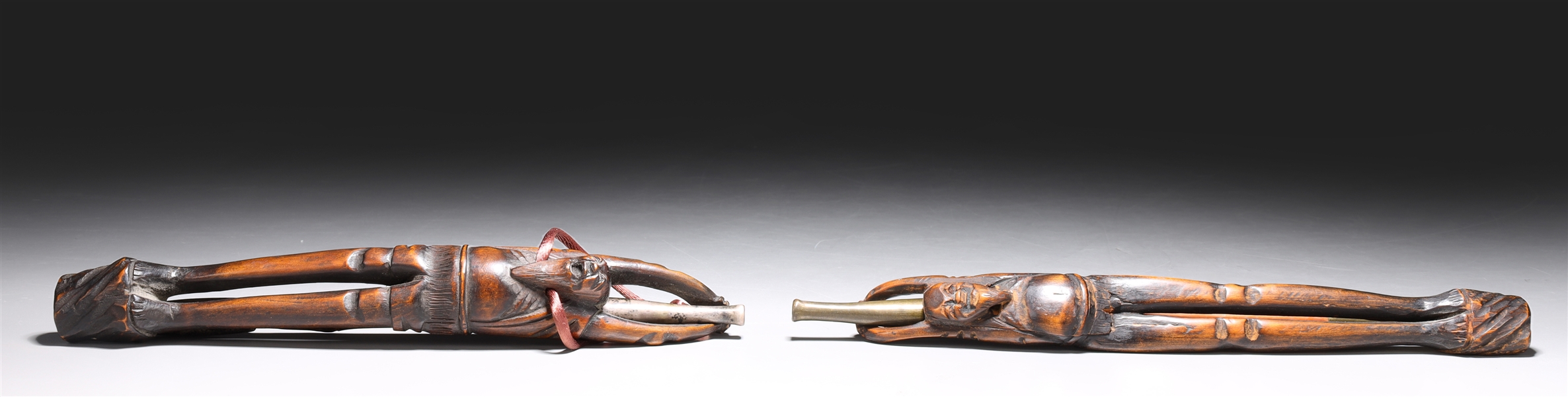 Appraisal: Two antique Chinese pipe and pipe holders each pipe with