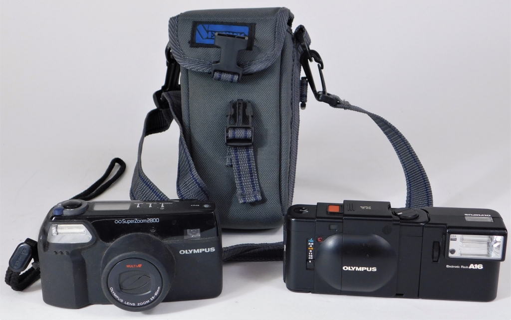 Appraisal: TWO OLYMPUS MM CAMERAS Two Olympus mm cameras Includes SuperZoom