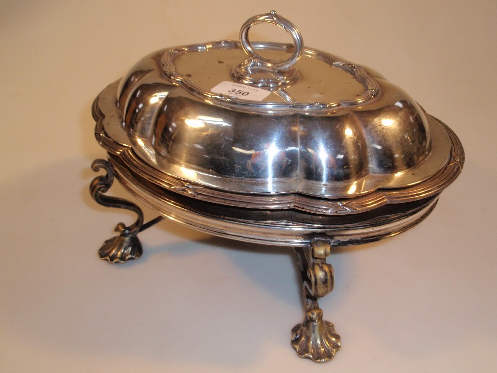 Appraisal: A silver and electroplate entre dish on warming stand the