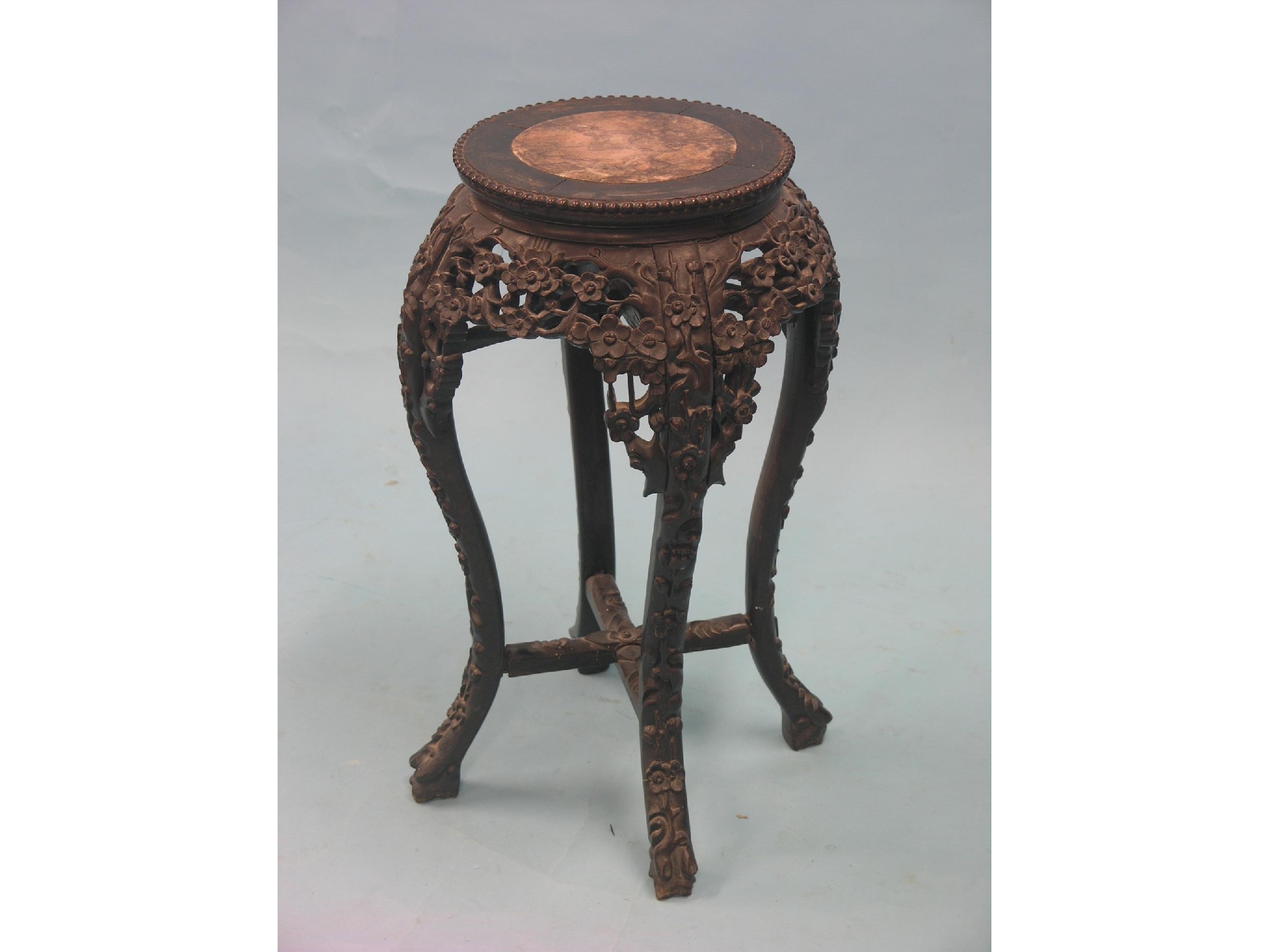 Appraisal: A Chinese carved rosewood jardiniere stand circular-shape on four cabriole