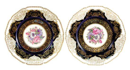 Appraisal: German porcelain plates ornate floral pattern on cobalt ground marked