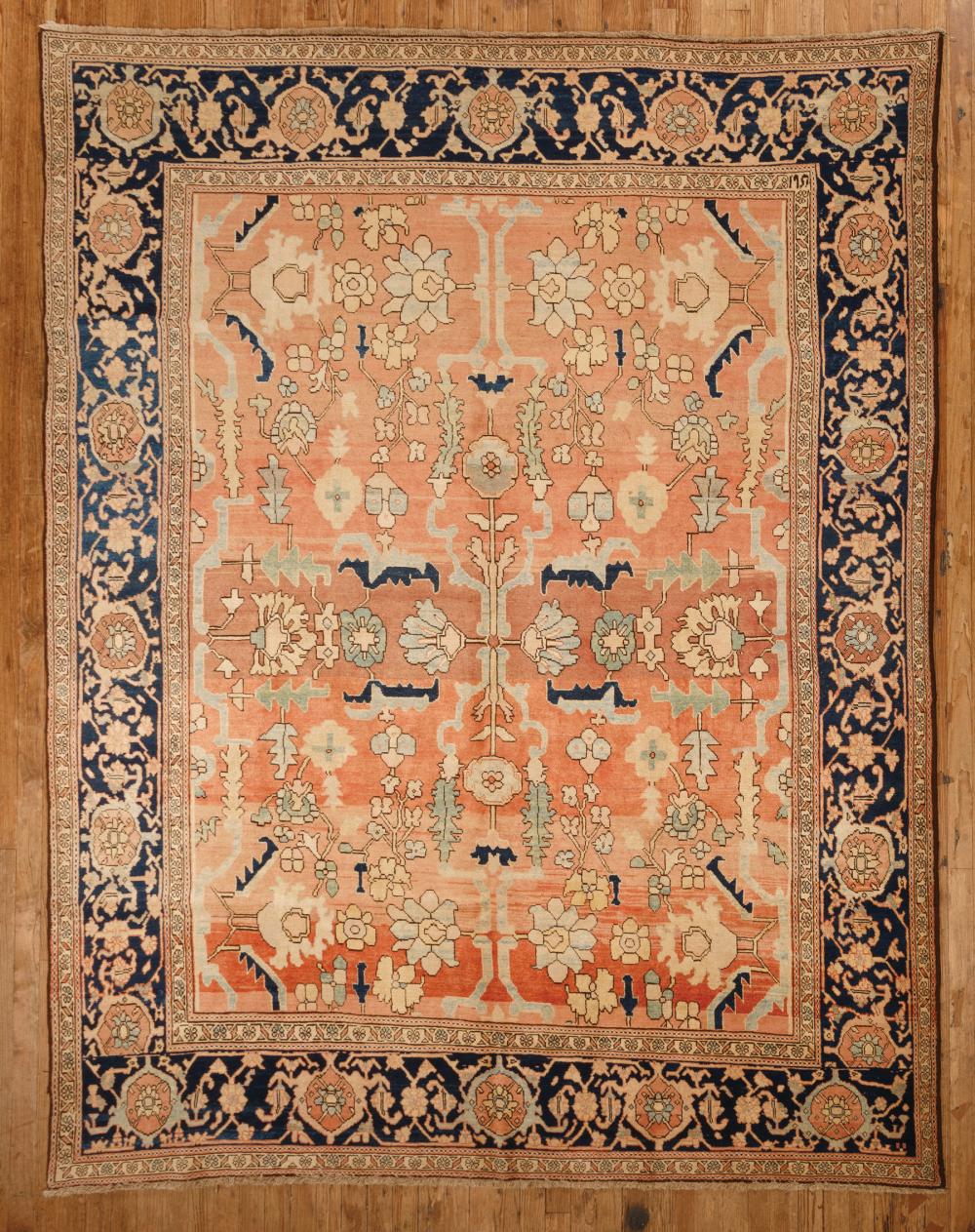 Appraisal: Persian Serapi Carpet salmon ground blue border stylized foliate design