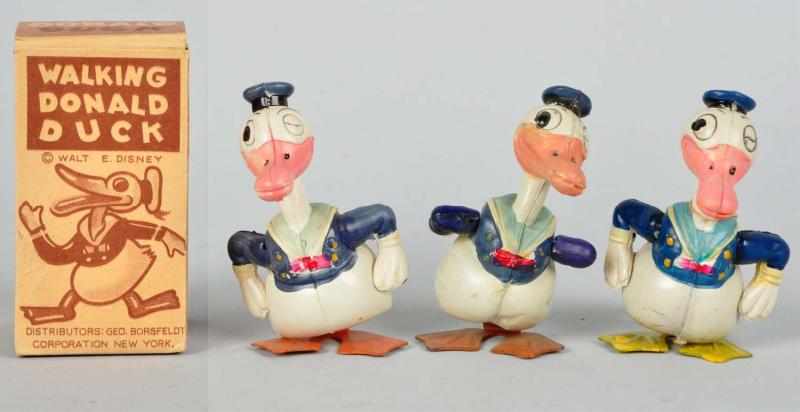 Appraisal: Lot of Celluloid Disney Donald Wind-Up Toys Description All marked