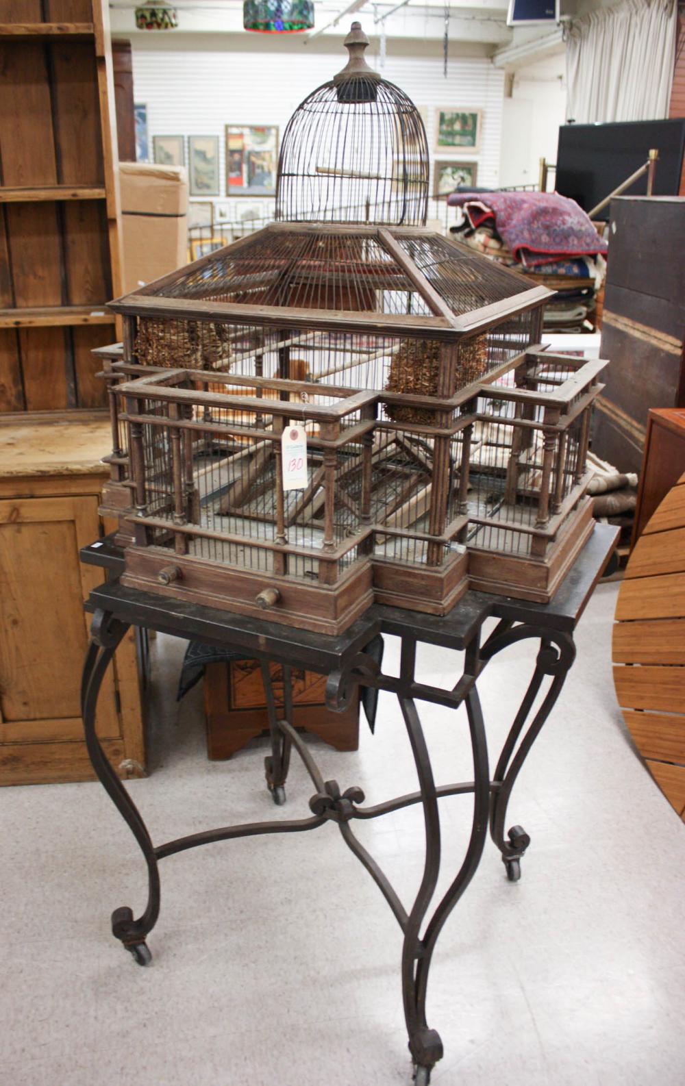 Appraisal: ARCHITECTURAL BIRDCAGE ON STAND a large wood and wire birdcage