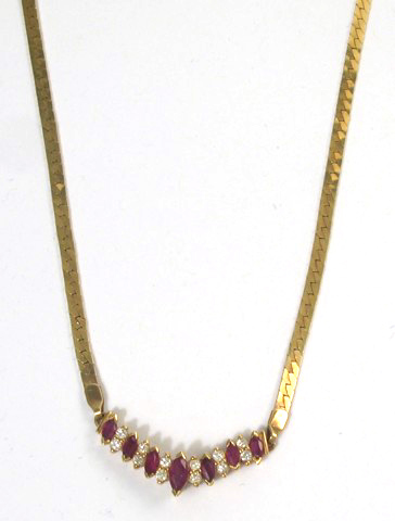 Appraisal: RUBY AND DIAMOND PENDANT NECKLACE k yellow gold The pendant