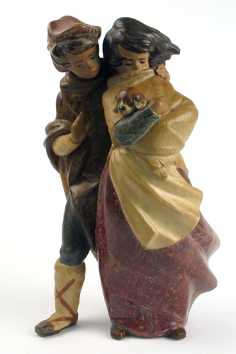 Appraisal: A SPANISH LLADRO FIGURAL GROUP The Wind No of boy