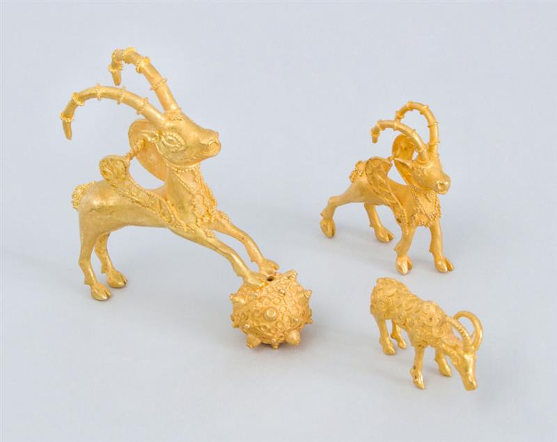 Appraisal: TWO K GOLD ACHAEMENID STYLE WINGED STAG PENDANTS AFTER THE