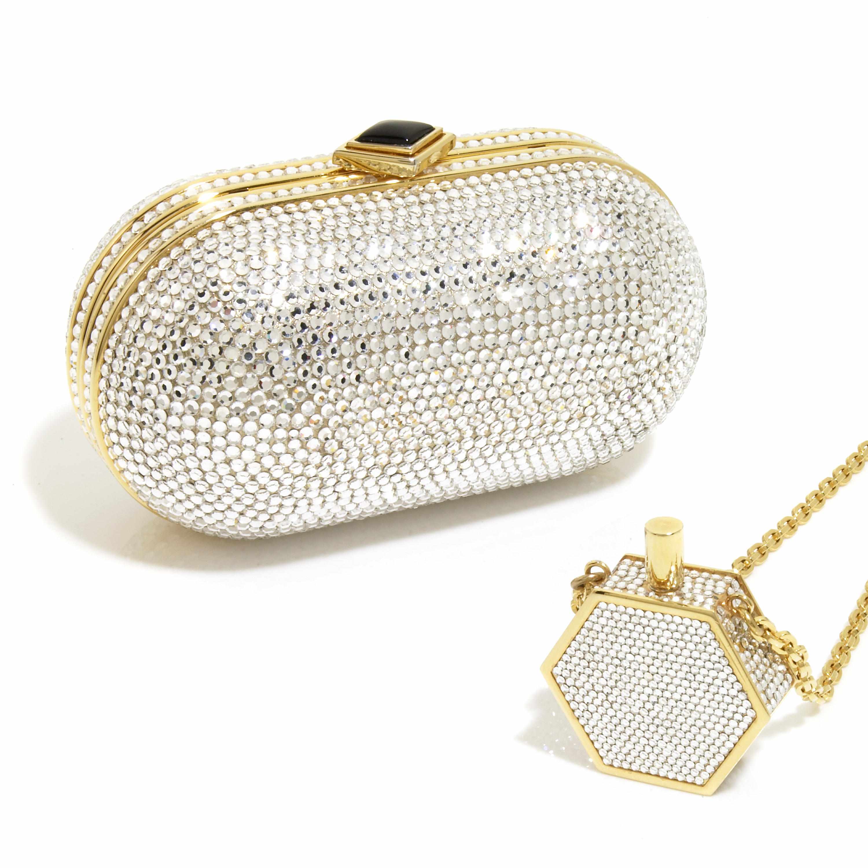 Appraisal: A silver crystal and gold colored metal pill-shaped purse together