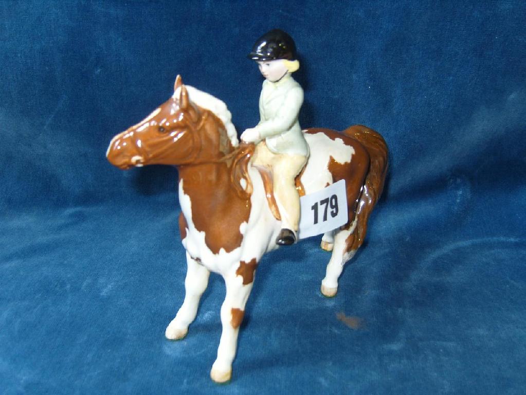 Appraisal: A Beswick model of a little girl in hunting costume