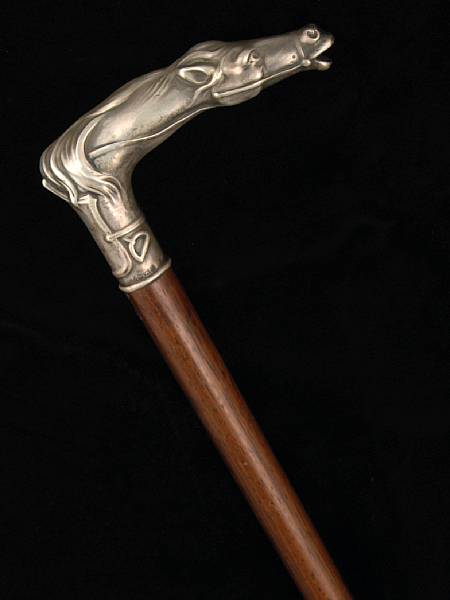 Appraisal: A German gent's walking stick with equestrian design sterling handleMaker's