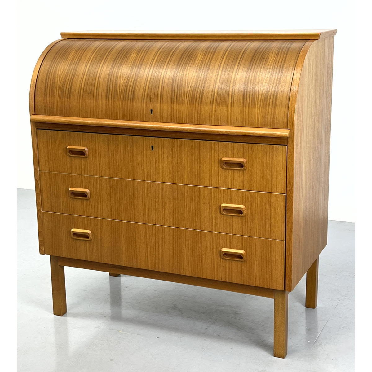 Appraisal: Danish Modern Teak three drawer roll top Desk with pull