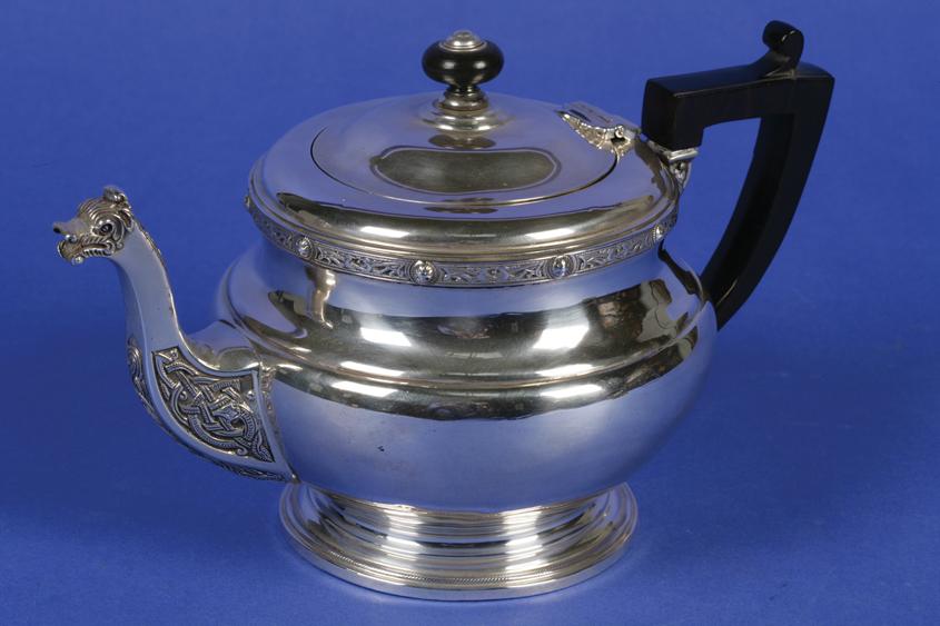 Appraisal: A GEORGE V TEAPOT of circular bellied form with Celtic