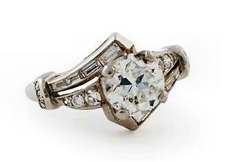 Appraisal: A diamond cluster ring the front of cross-over design claw