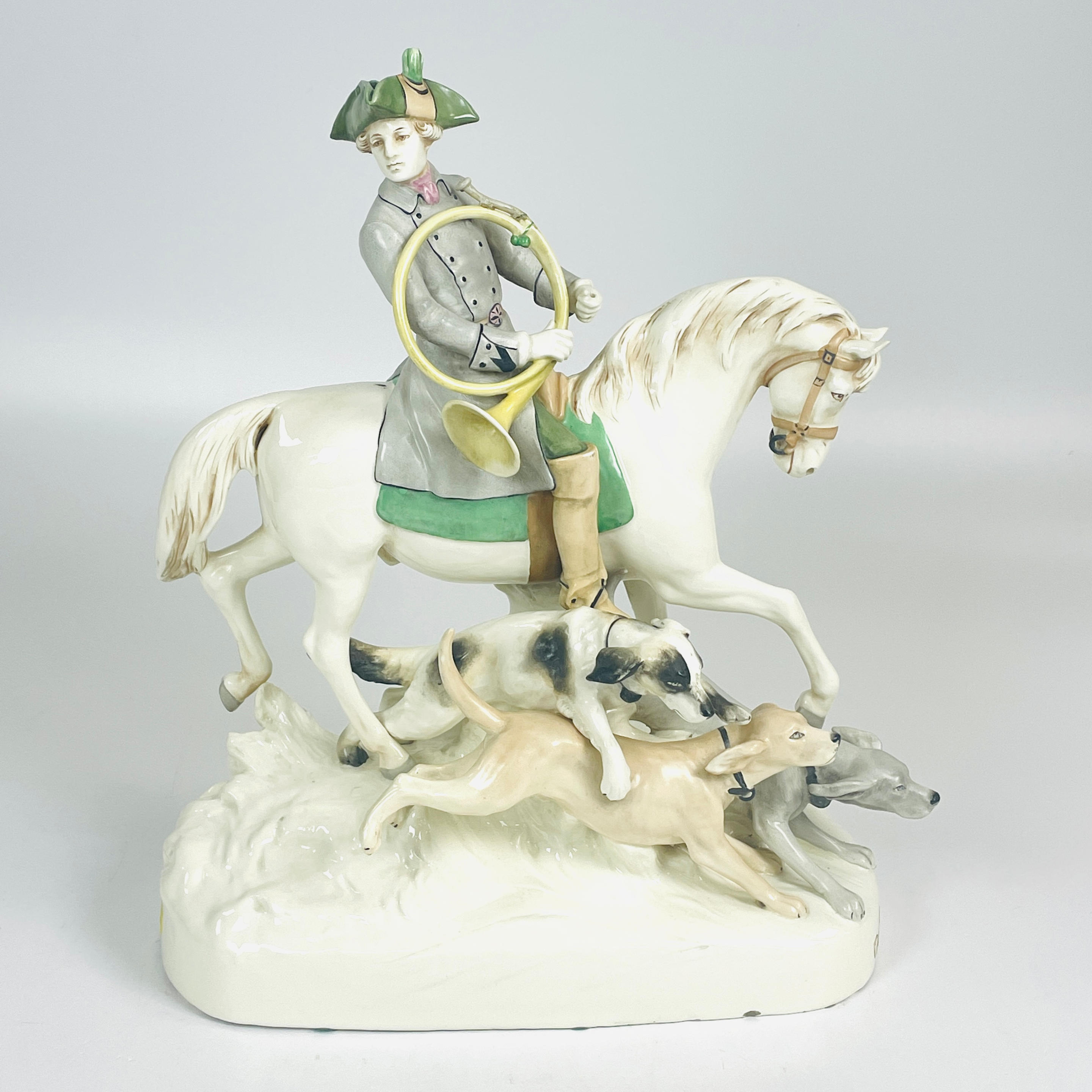 Appraisal: ROYAL DUX PORCELAIN HUNTING FIGURE modeled as a hunter holding