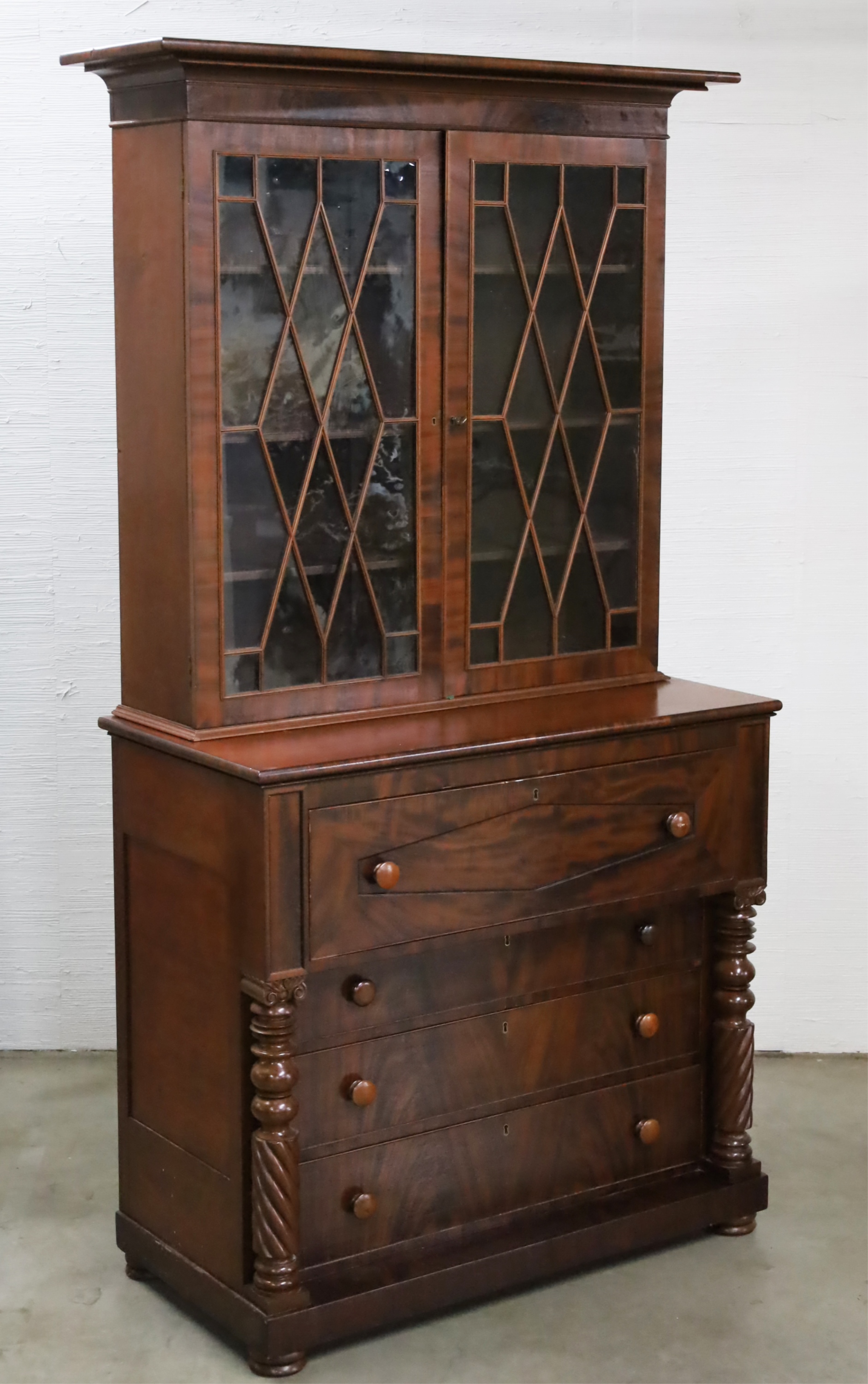 Appraisal: AMERICAN MAHOGANY SECRETAIRE BOOKCASE TH C American classical mahogany secretaire