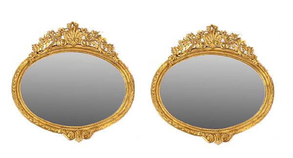 Appraisal: A pair of Louis XVI style gilt oval mirrors height