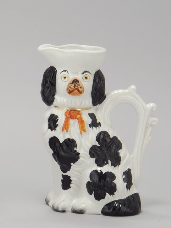 Appraisal: STAFFORDSHIRE SPANIEL-FORM JUG Circa In black and white with orange