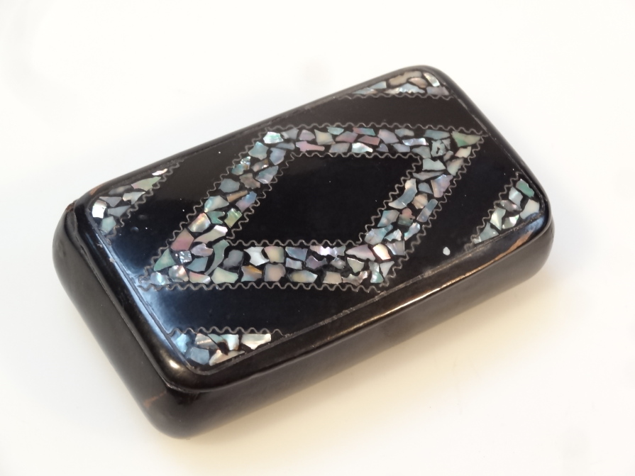 Appraisal: A thC papier mache snuff box the oblong body set