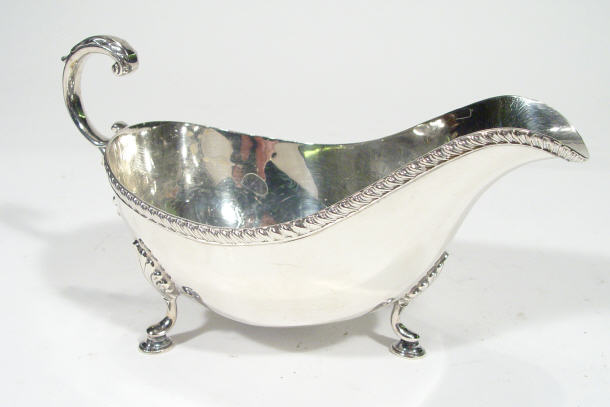 Appraisal: Silver sauce boat with acanthus moulded feet Birmingham cm in