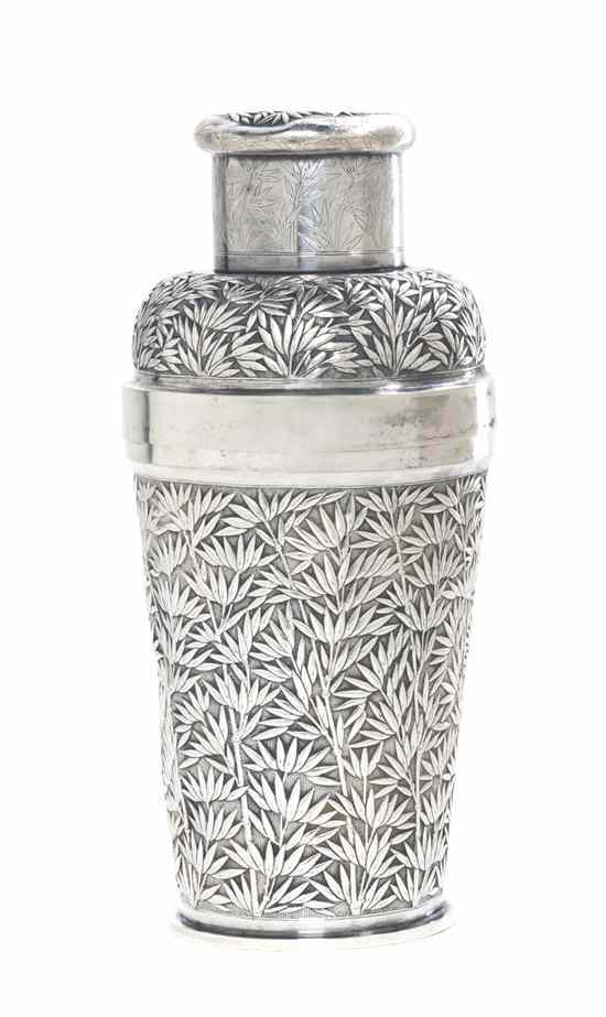 Appraisal: A Japanese Silver Cocktail Shaker having repousse decoration throughout of