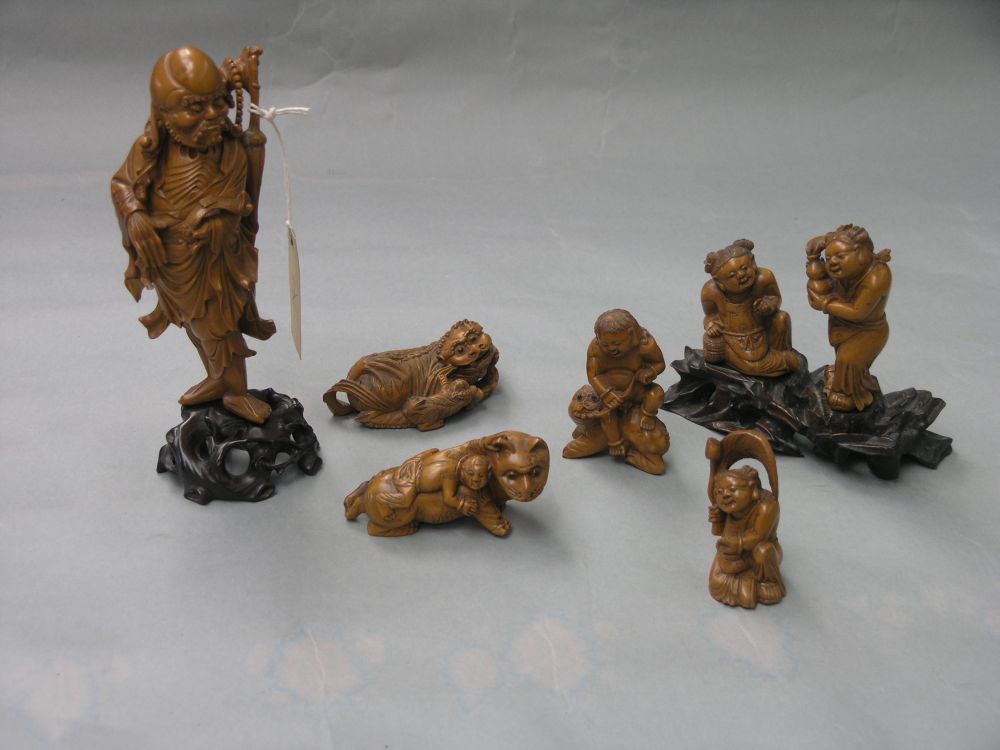 Appraisal: Six Cantonese wood carvings including a bearded elder in and