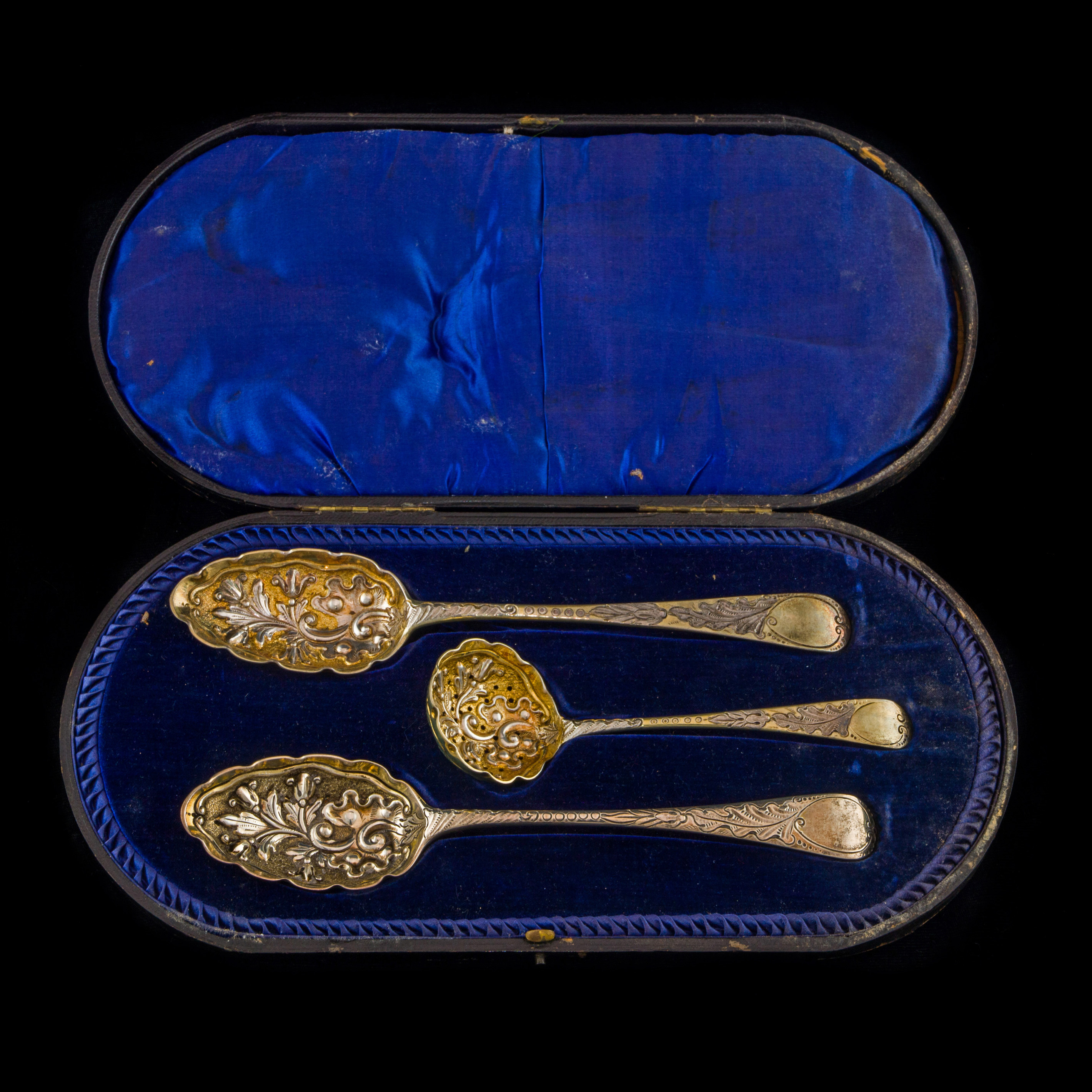 Appraisal: A GEORGE IV GILT STERLING CASED REPOUSSE SPOON SET A