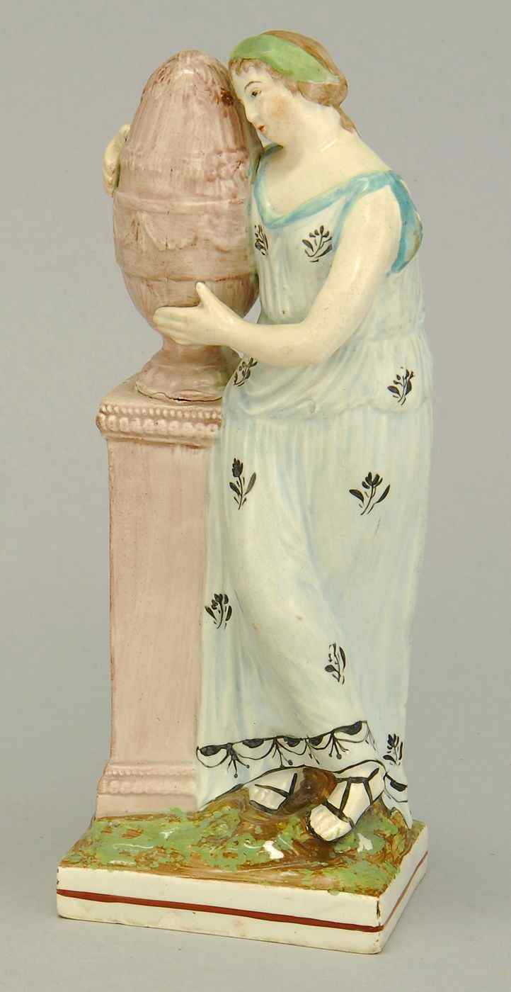 Appraisal: ANTIQUE ENGLISH STAFFORDSHIRE FIGURE OF A WOMANLate th Early th