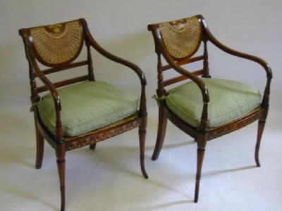 Appraisal: A PAIR OF REGENCY STYLE PAINTED MAHOGANY ELBOW CHAIRS in