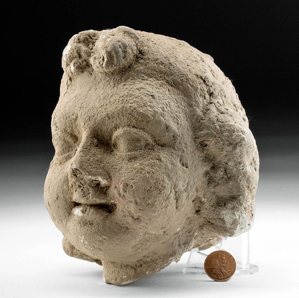 Appraisal: Realistic th C Gandharan Stucco Head of a Child Central