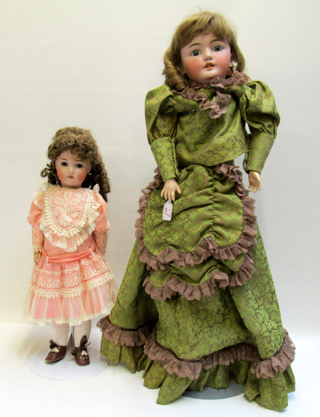 Appraisal: TWO GERMAN BISQUE HEAD DOLLS both socket heads on ball