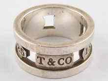 Appraisal: A white metal tests silver pierced band ring by Tiffany