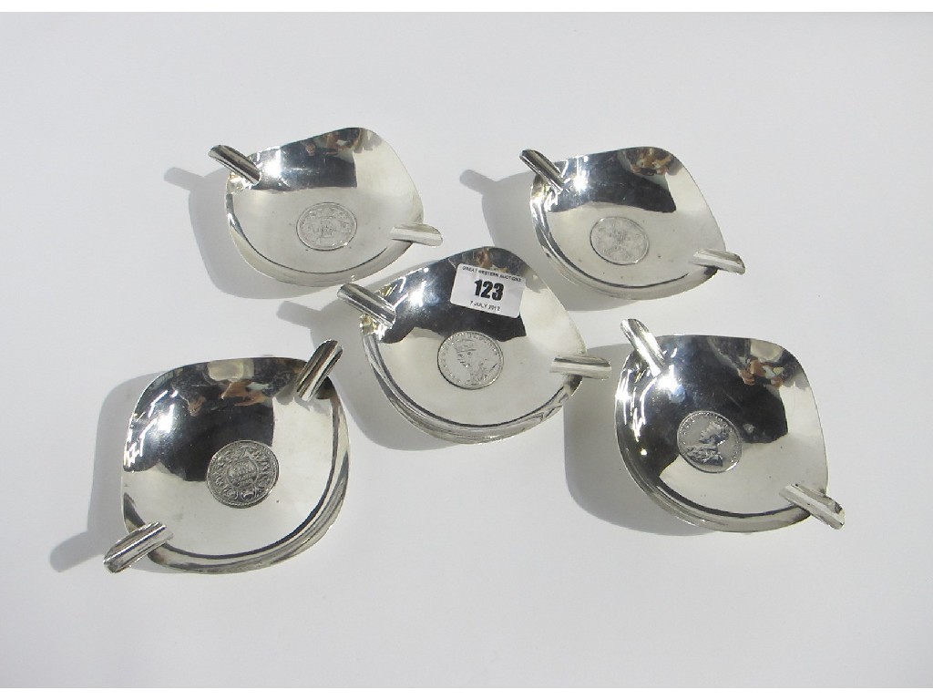 Appraisal: A set of five sterling silver ashtrays set with one