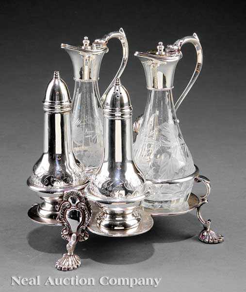 Appraisal: A Georgian-Style Silverplate Cruet Stand quadrilobed stand with elaborate C-scroll