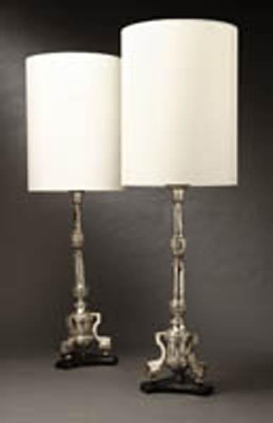 Appraisal: A pair of Continental silvered altar stick lamps A pair